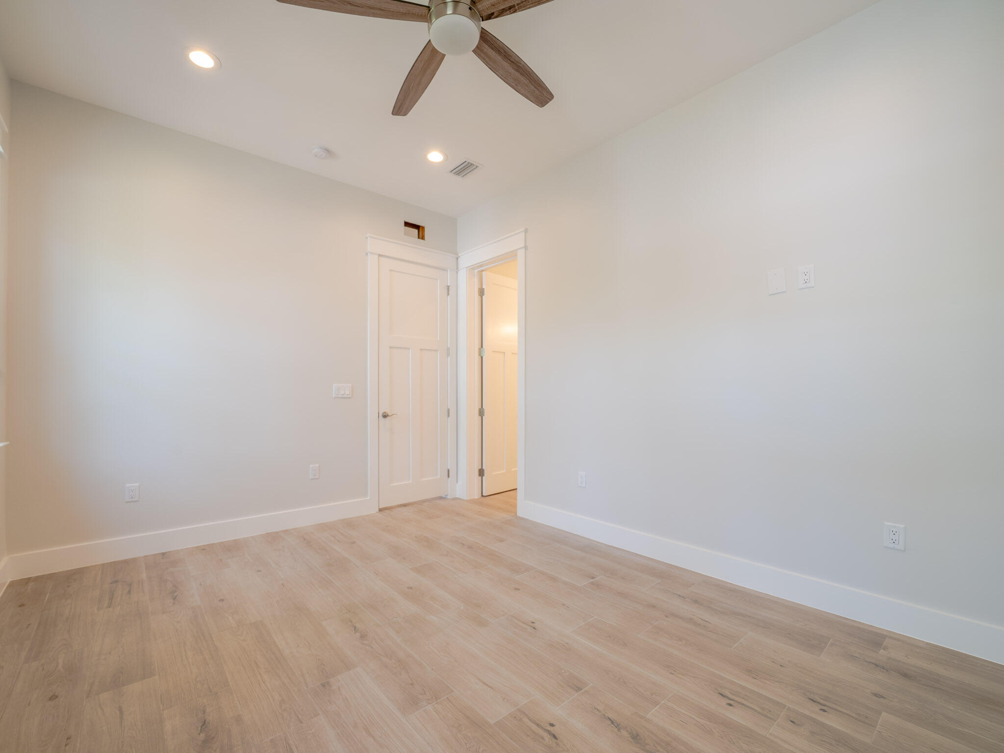 116 East Georgie Street Point Washington, FL 32459 - Photo 30 of 46 an empty room with a ceiling fan and carpet