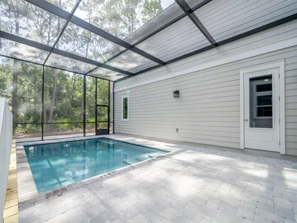 a view of a house with a backyard and a garage