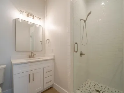 a view of a kitchen with a sink and cabinet area