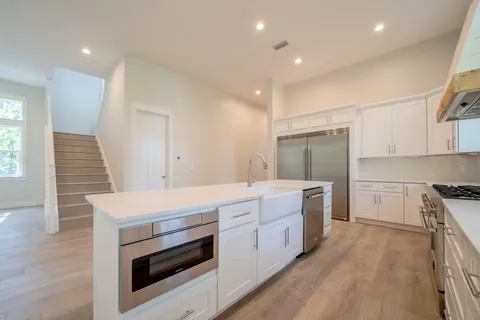 a kitchen with a stove and a sink