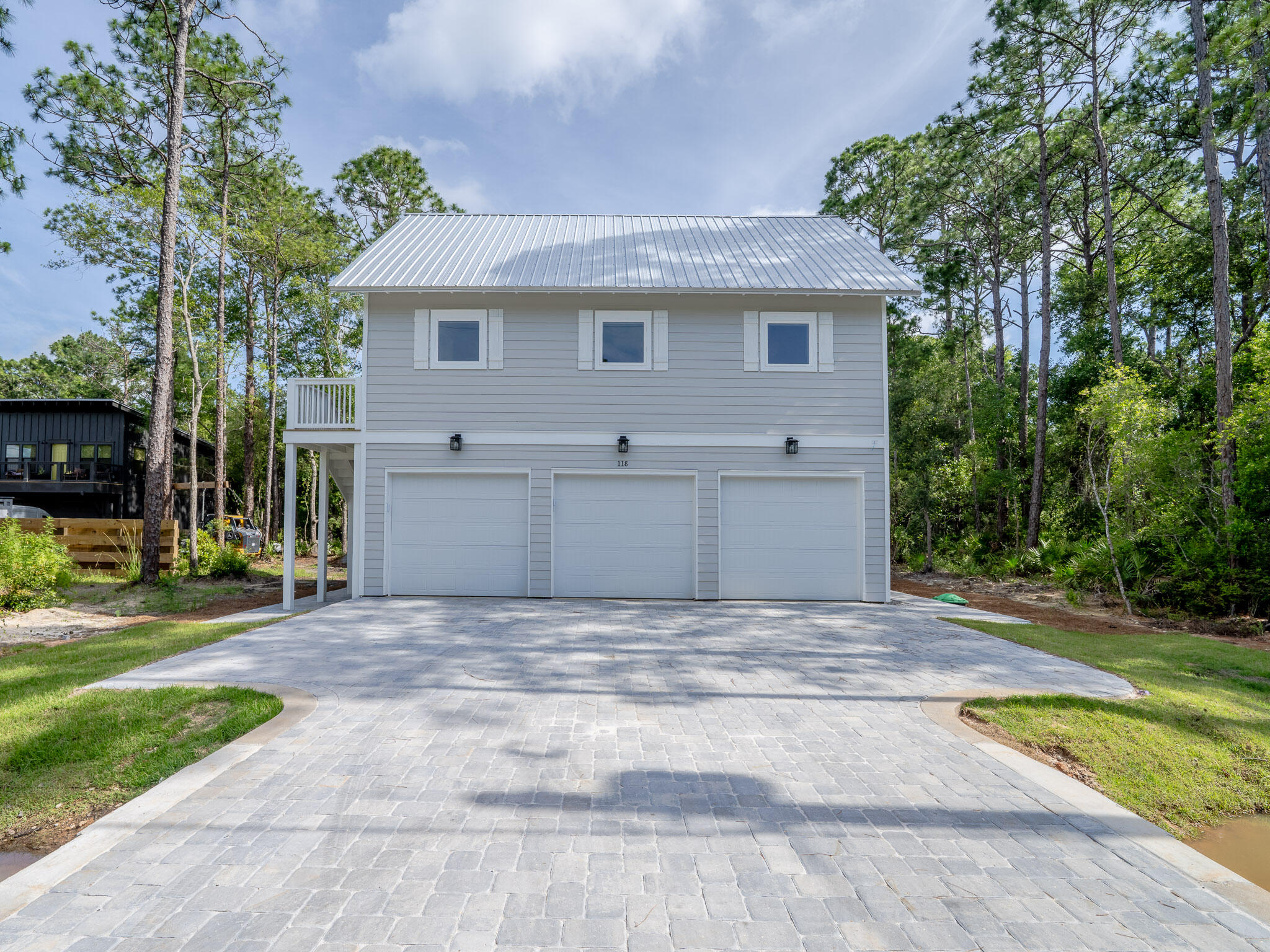 116 East Georgie Street Point Washington, FL 32459 - Photo 10 of 46 a front view of a house with a garden and yard