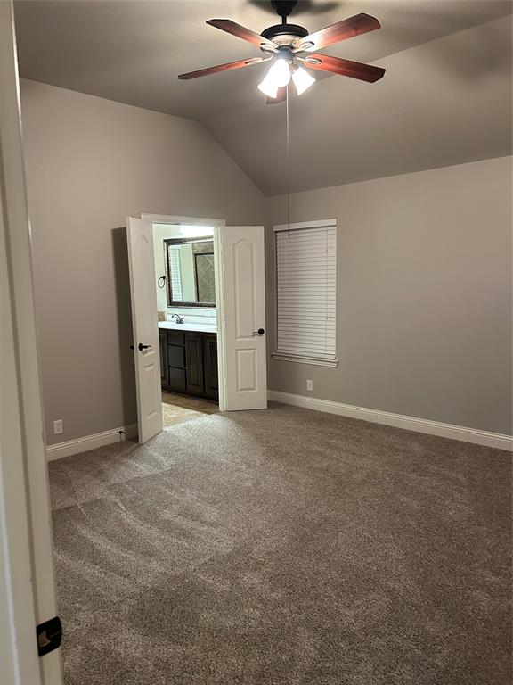4302 Spruce Road Melissa, TX 75454 - Photo 6 of 15 an empty room with chandelier fan and kitchen view