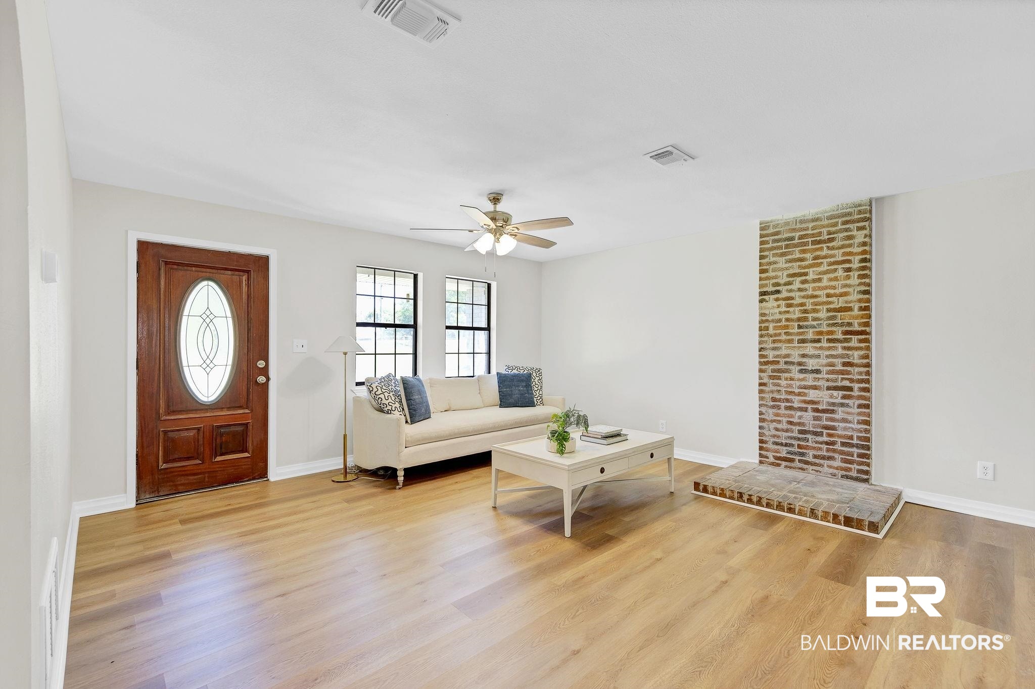 11964 Stroh Road Daphne, AL 36527 - Photo 13 of 58 Living room featuring visible vents, ceiling fan, and wood finished floors