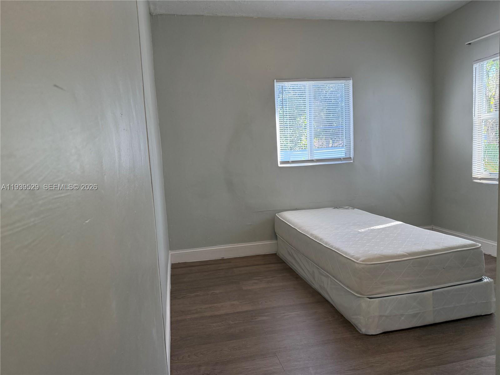 22 Northeast 51st Street, Unit 2 Miami, FL 33137 - Photo 12 of 14 a room with a bed and a window