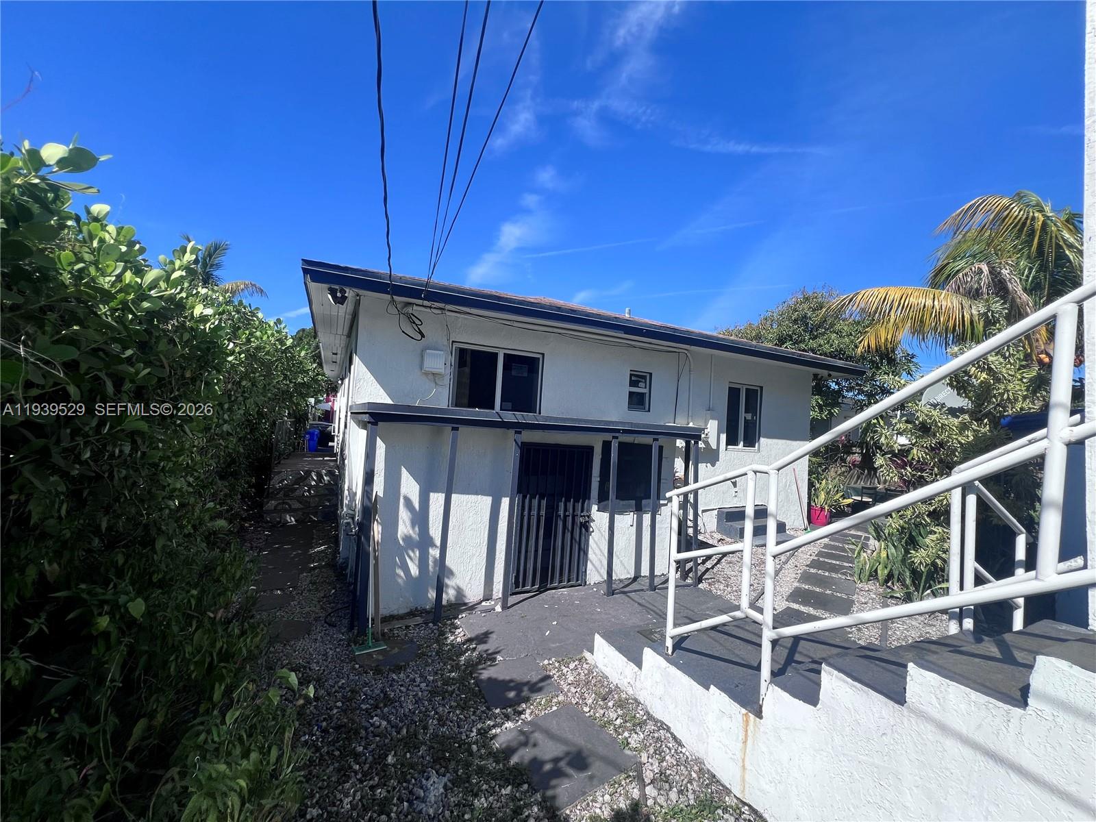 22 Northeast 51st Street, Unit 2 Miami, FL 33137 - Photo 3 of 14 a view of house with patio and entertaining space