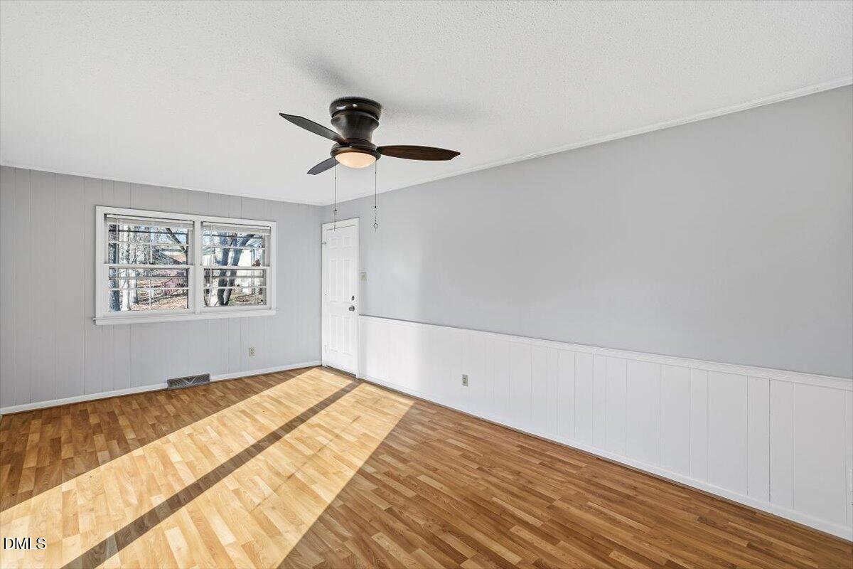 511 Hunter Street Durham, NC 27712 - Photo 12 of 31 a view of empty room with wooden floor