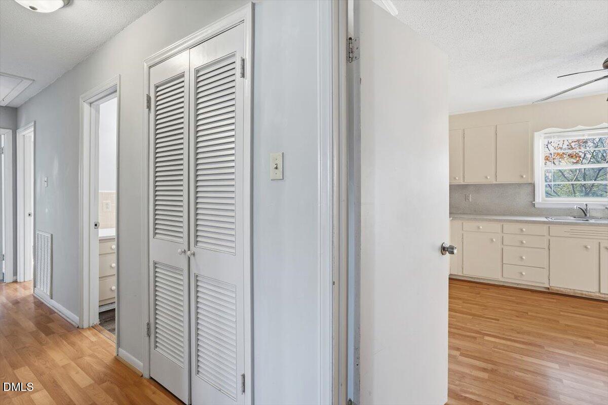 511 Hunter Street Durham, NC 27712 - Photo 17 of 31 a view of a kitchen with wooden floor and cabinets
