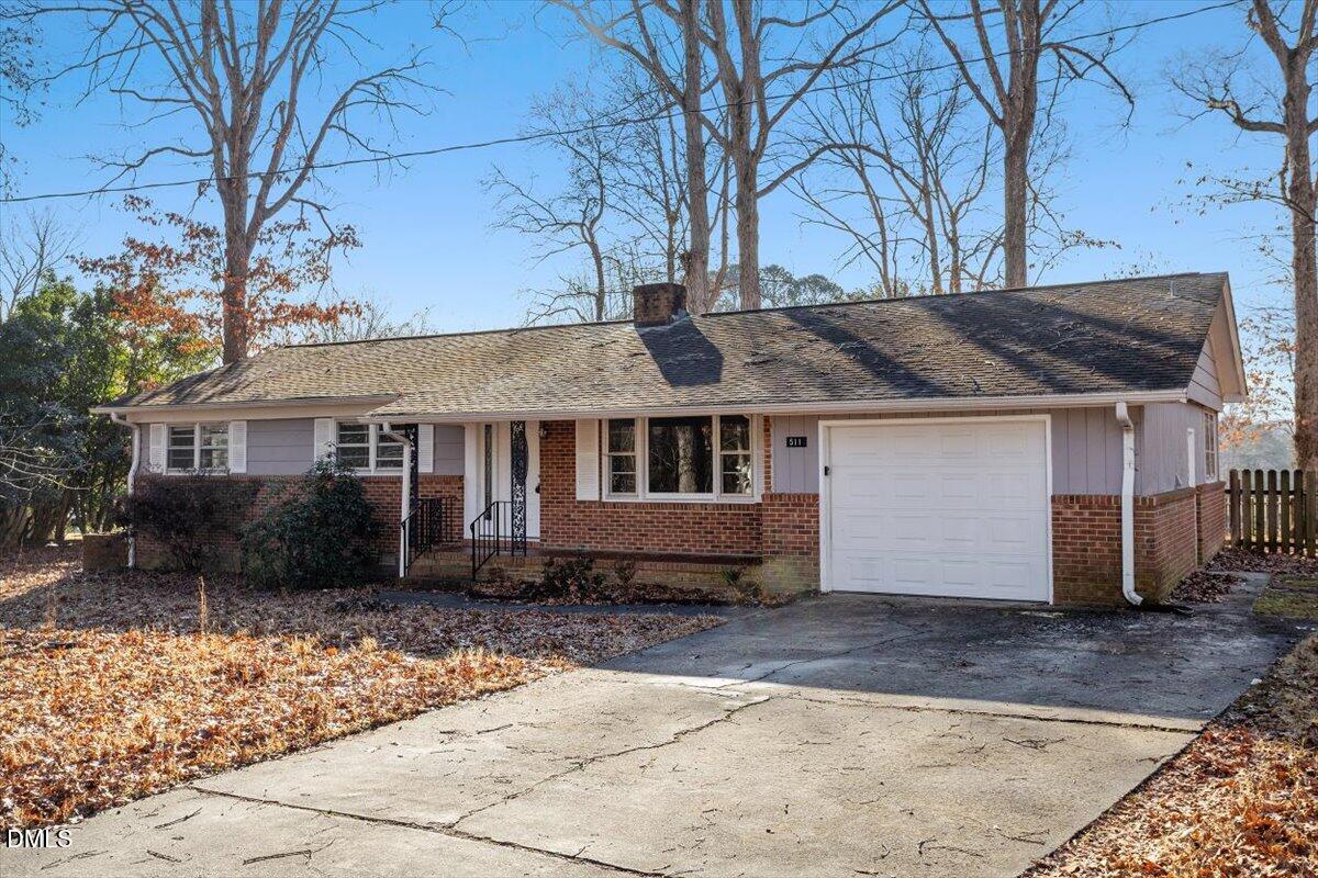 511 Hunter Street Durham, NC 27712 - Photo 2 of 31 a front view of a house with a yard