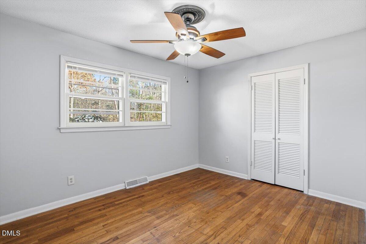 511 Hunter Street Durham, NC 27712 - Photo 25 of 31 a view of an empty room with wooden floor and a window