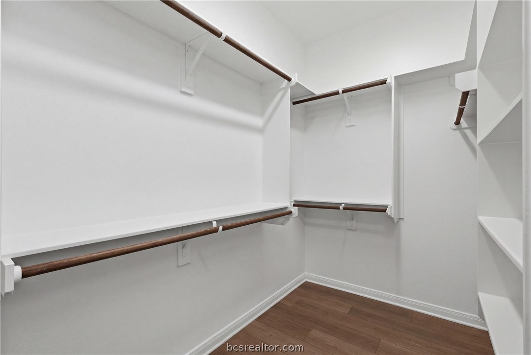 1922 Viva Road Bryan, TX 77807 - Photo 21 of 45 Spacious walk-in closet in the primary suite offering abundant storage and organization space.