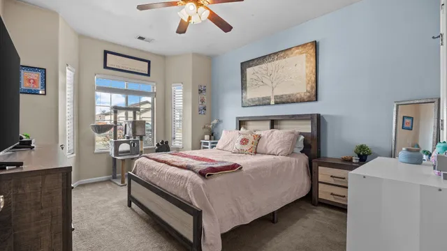 a bathroom with a granite countertop sink mirror toilet and shower