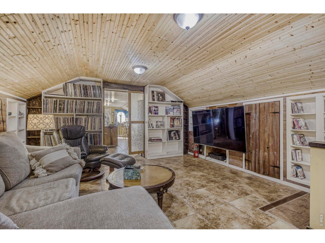 1042 Steamboat Valley Road Lyons, CO 80540 - Photo 22 of 46 Office/Den/2nd Living Room, leading to third story, East Wing. Beautiful wainscot ceiling.