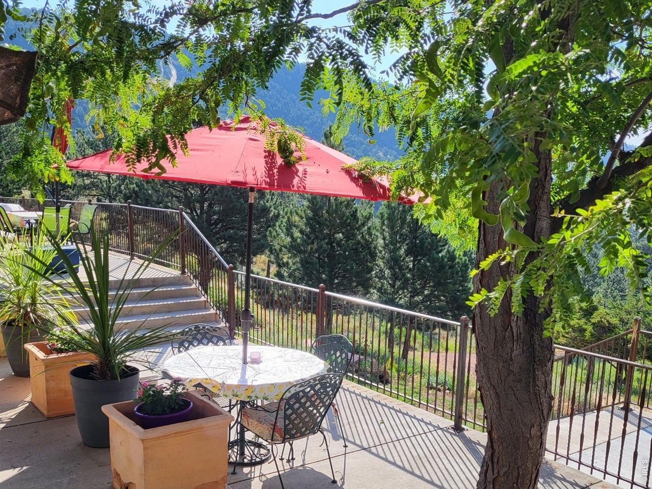1042 Steamboat Valley Road Lyons, CO 80540 - Photo 33 of 46 Expansive reinforced NEW concrete deck that sprawls nearly the entire front of the home.