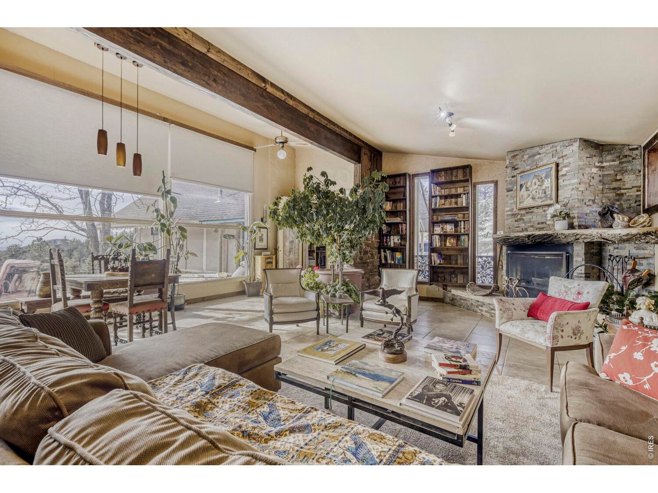 1042 Steamboat Valley Road Lyons, CO 80540 - Photo 7 of 46 Flagstone walls. 15+ foot ceilings. NEW fireplace. Electronic blinds.