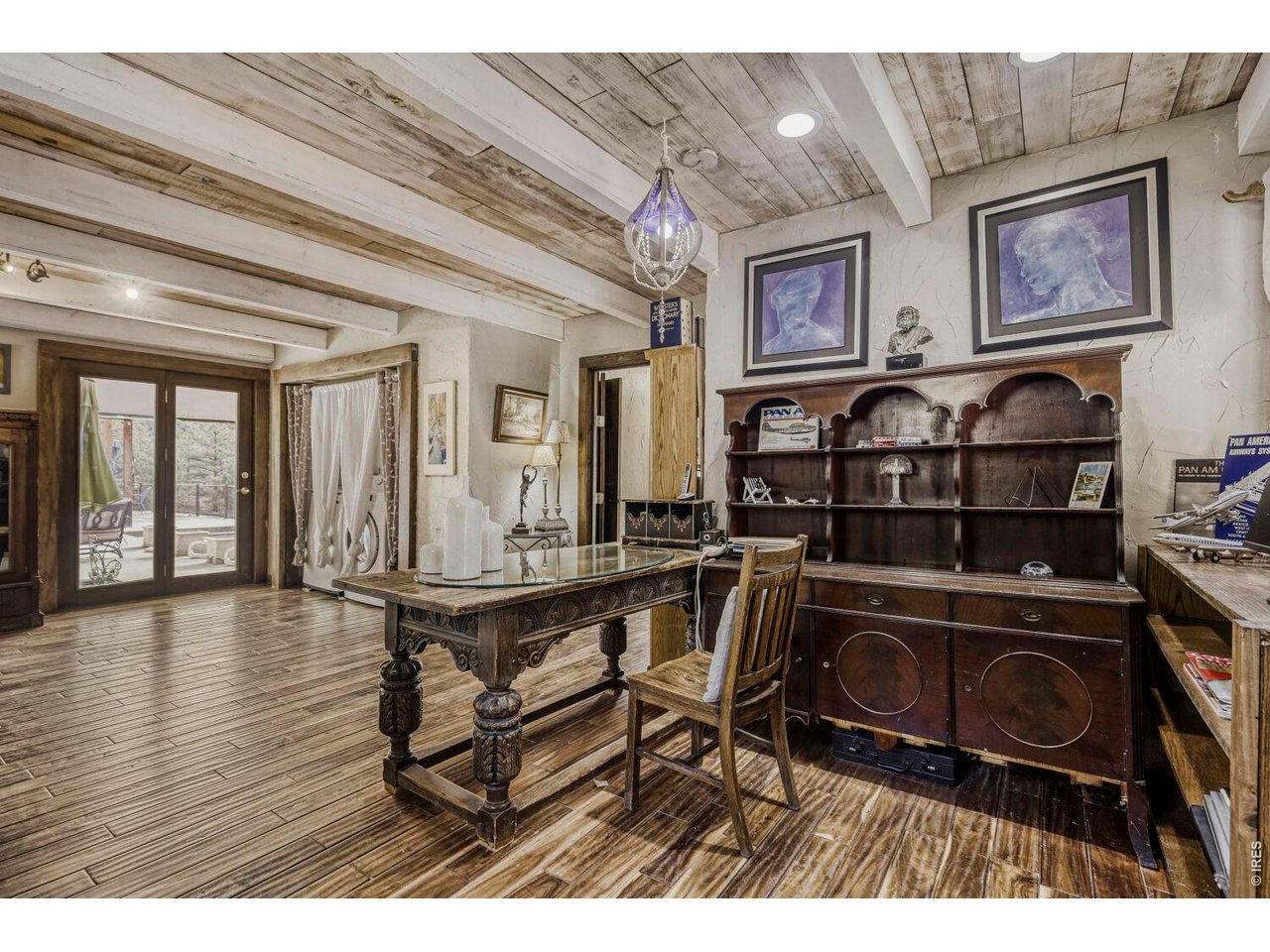 1042 Steamboat Valley Road Lyons, CO 80540 - Photo 9 of 46 West Wing - Office Den off Primary Suit featuring ceilings beams, rich hardwood floors, and French doors
