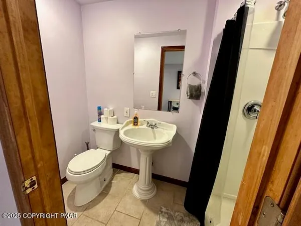 a bathroom with a sink and a toilet