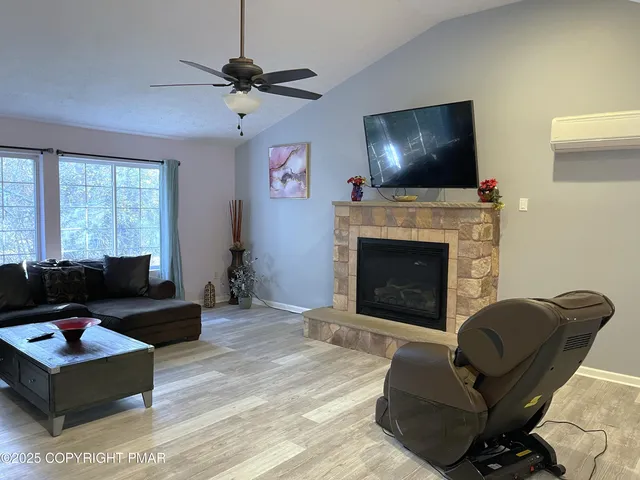 a living room with furniture and a flat screen tv