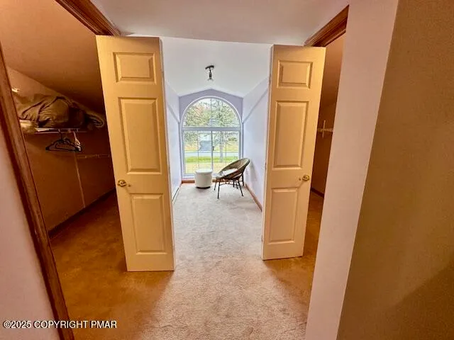 a view of a hallway with windows