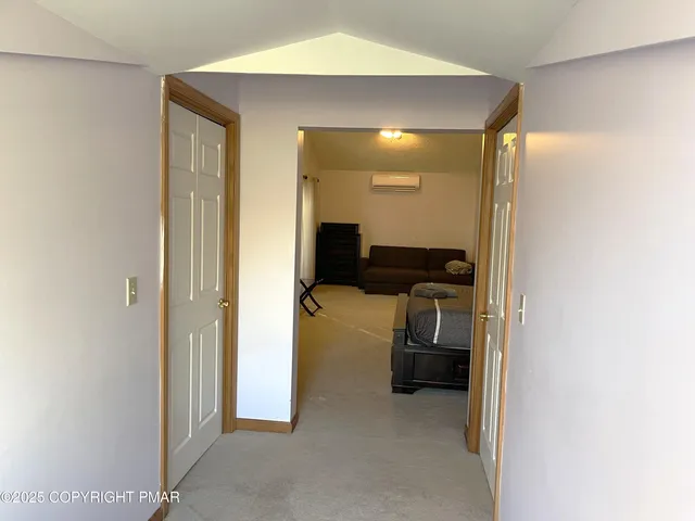 a view of hallway with walk in closet