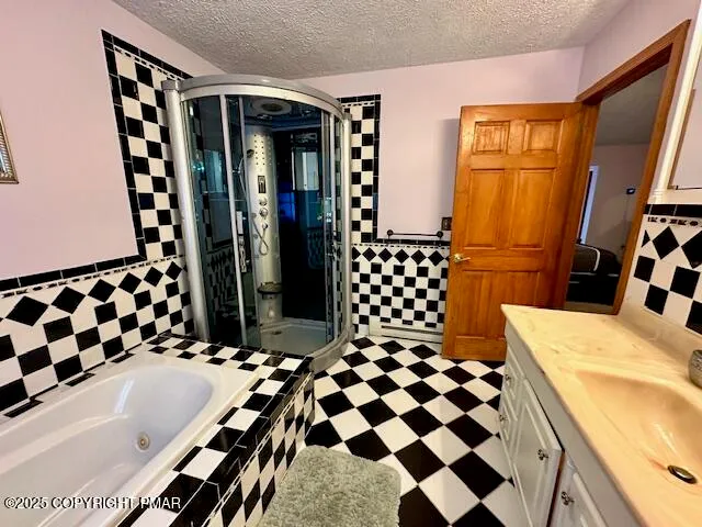 a bathroom with a bathtub and shower