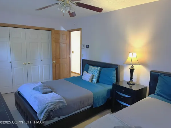 a bedroom with a bed and a lamp