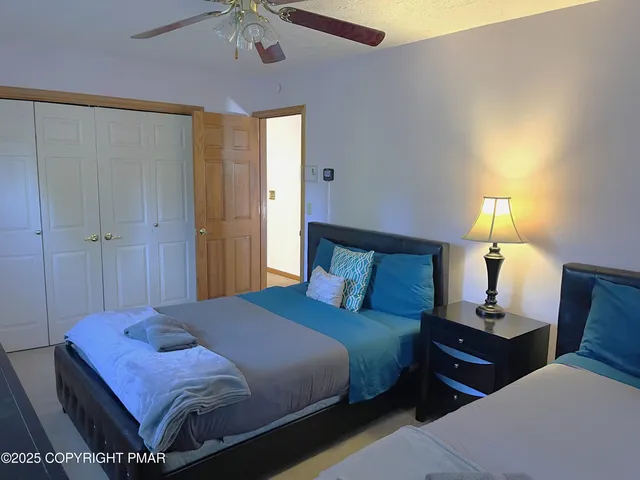 a bedroom with a bed and a lamp