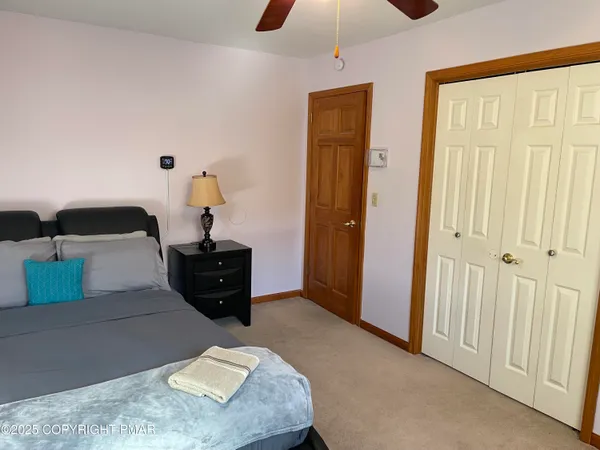 a bed room with a bed and a chandelier