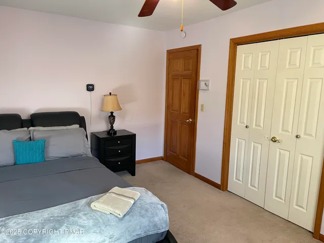 a bed room with a bed and a chandelier