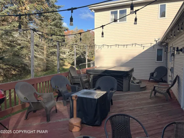 a balcony with table and chairs