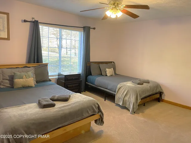 a bedroom with bed and window