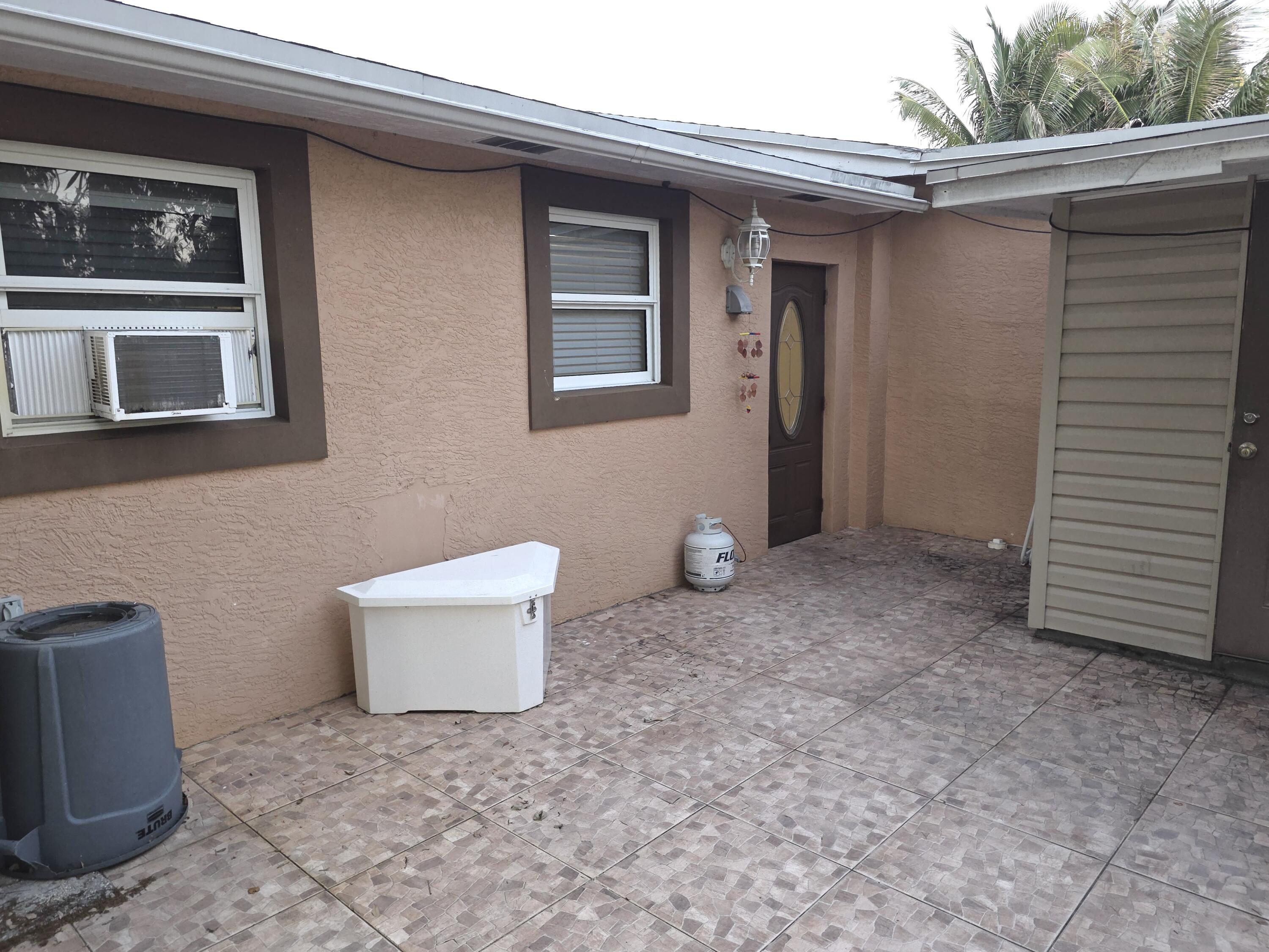 4118 Ruth Road Lake Worth, FL 33461 - Photo 12 of 21 a view of a house with a yard