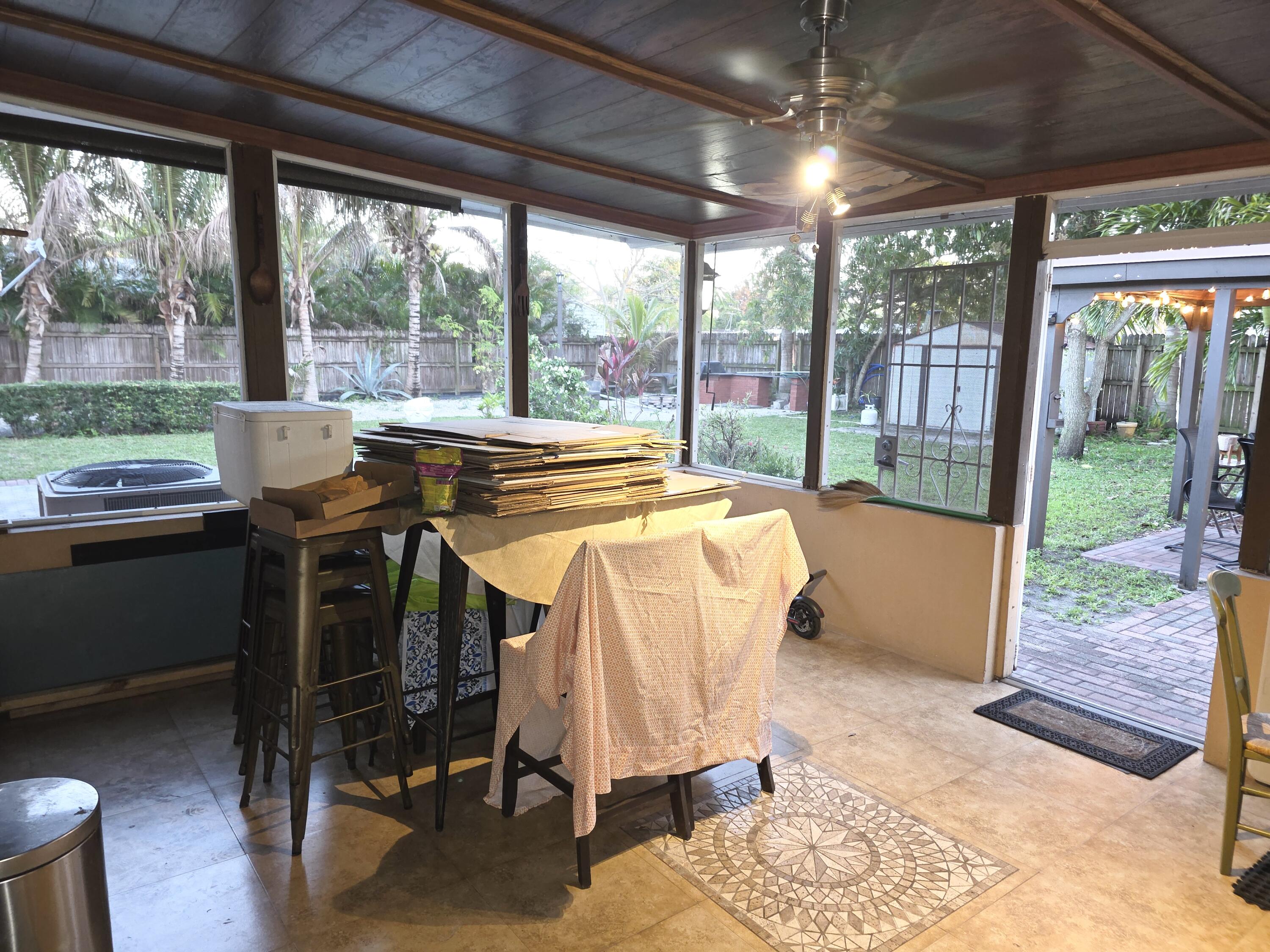 4118 Ruth Road Lake Worth, FL 33461 - Photo 5 of 21 a view of a dining room with furniture window and outside view