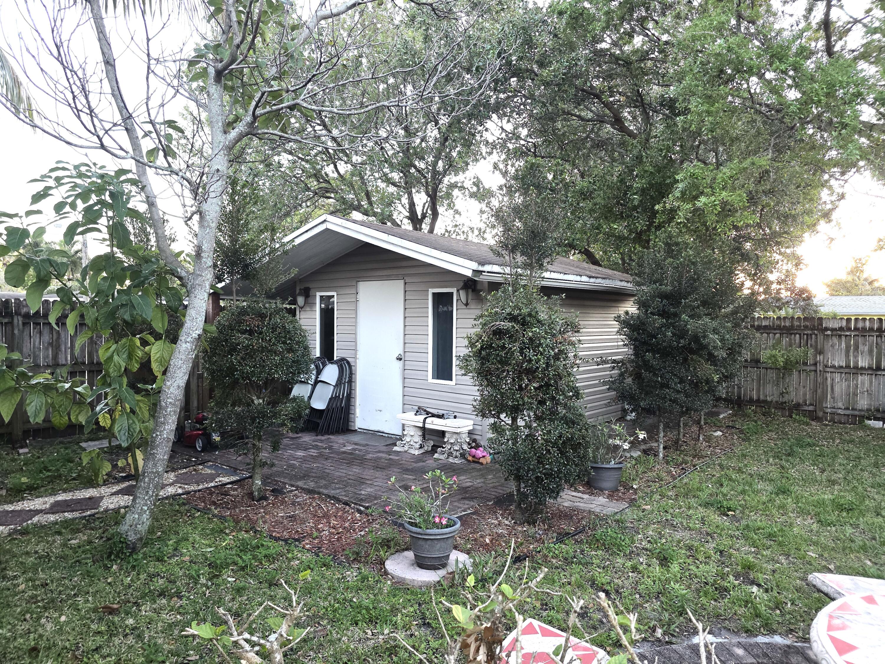 4118 Ruth Road Lake Worth, FL 33461 - Photo 10 of 21 a view of a house with a yard and tree s