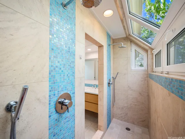 a bathroom with a tub and shower