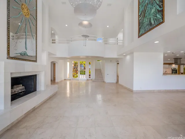 a view of an empty room and a fireplace