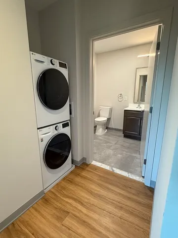 a view of a hallway with washer and dryer