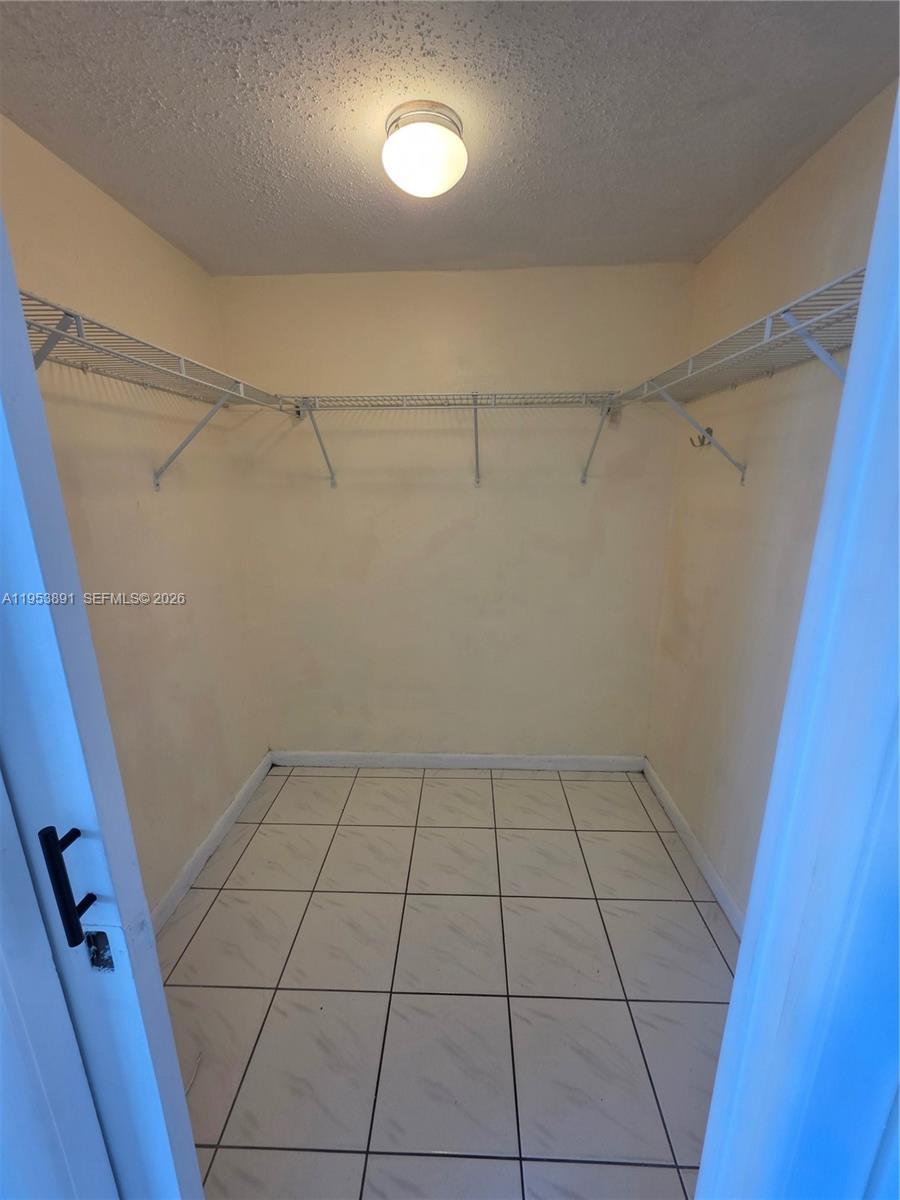 8600 Southwest 133rd Avenue Road, Unit 424 Miami, FL 33183 - Photo 11 of 27 a view of an empty walk in closet
