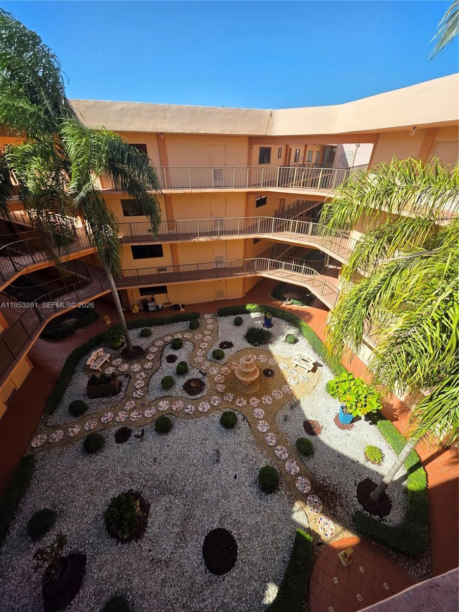 8600 Southwest 133rd Avenue Road, Unit 424 Miami, FL 33183 - Photo 18 of 27 a view of a backyard with plants and outdoor seating