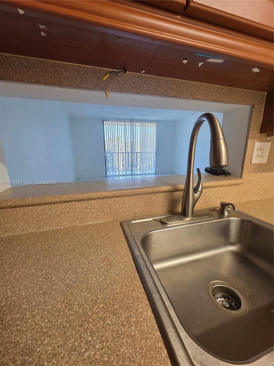 8600 Southwest 133rd Avenue Road, Unit 424 Miami, FL 33183 - Photo 2 of 27 a close view of sink and tap