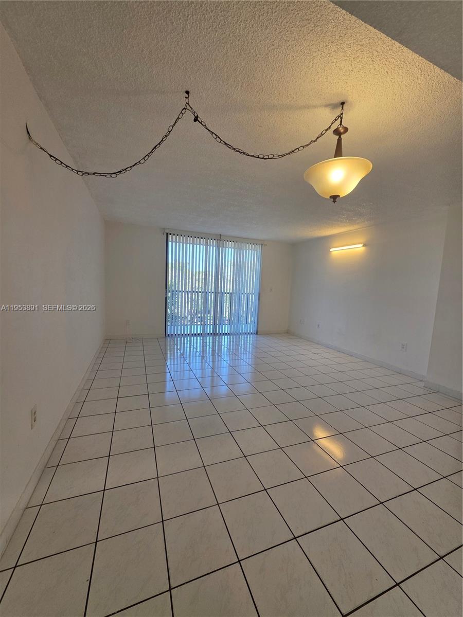 8600 Southwest 133rd Avenue Road, Unit 424 Miami, FL 33183 - Photo 4 of 27 a view of an empty room and window