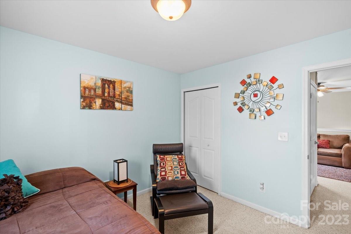 13004 Rothe House Road Charlotte, NC 28273 - Photo 14 of 27 a bedroom with a bed and a table