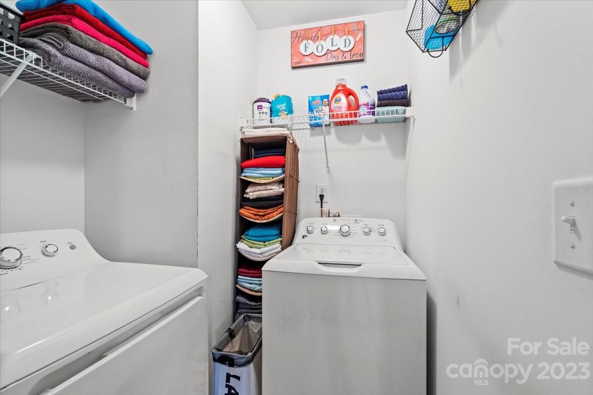13004 Rothe House Road Charlotte, NC 28273 - Photo 18 of 27 a utility room with dryer and washer