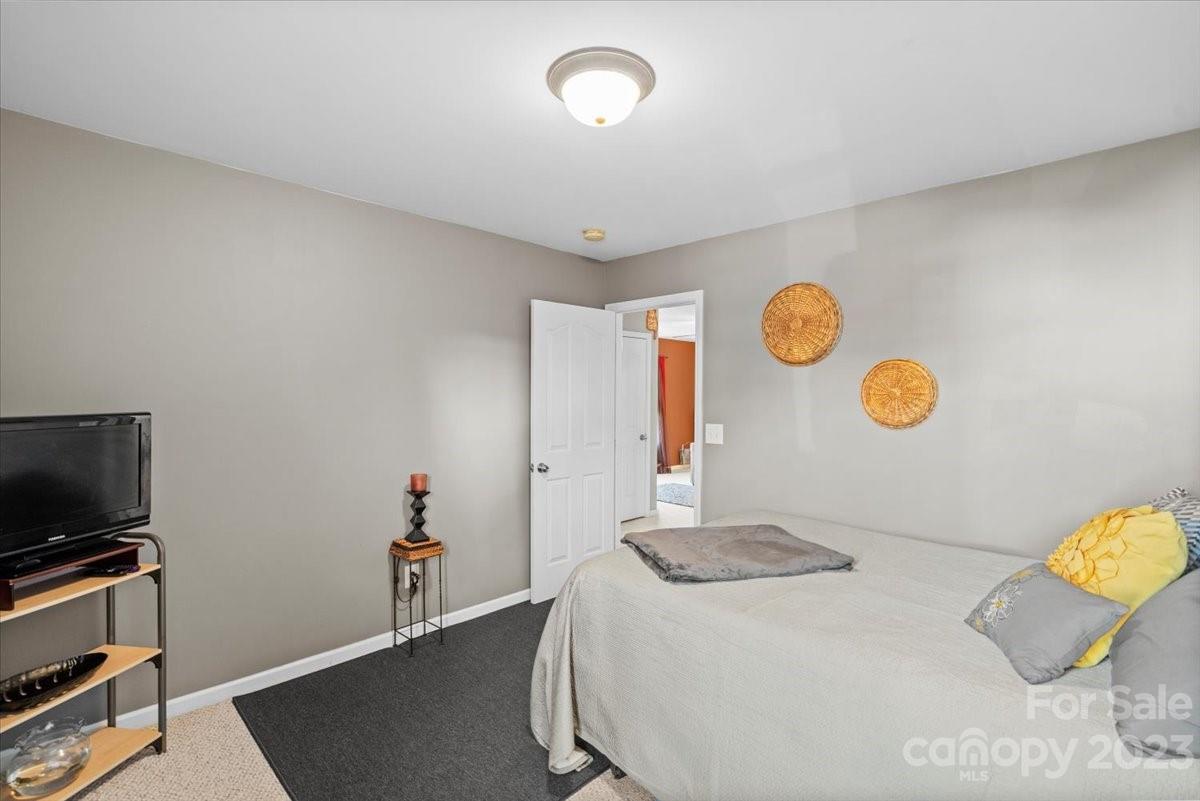 13004 Rothe House Road Charlotte, NC 28273 - Photo 20 of 27 a bedroom with a bed and a window