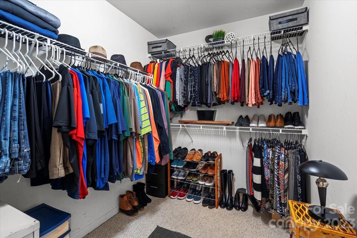 13004 Rothe House Road Charlotte, NC 28273 - Photo 26 of 27 a view of walk in closet with clothes