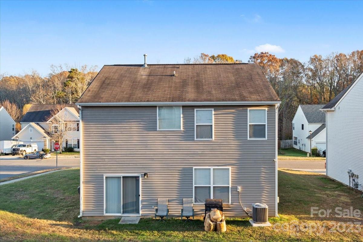 13004 Rothe House Road Charlotte, NC 28273 - Photo 27 of 27 a front view of a house with a yard