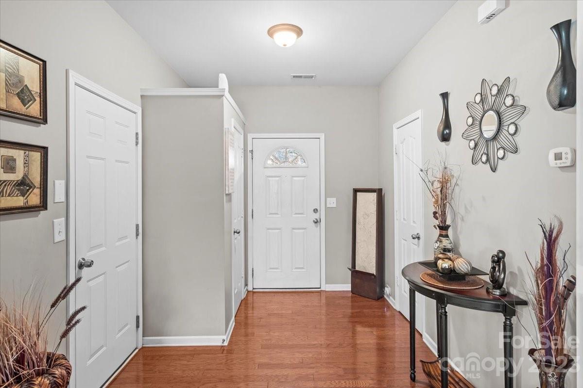 13004 Rothe House Road Charlotte, NC 28273 - Photo 4 of 27 a view of a hallway with workspace and a window