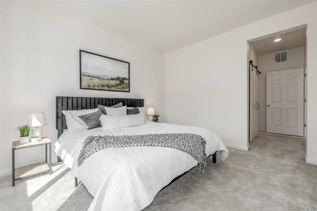 a bathroom with a granite countertop sink mirror and double