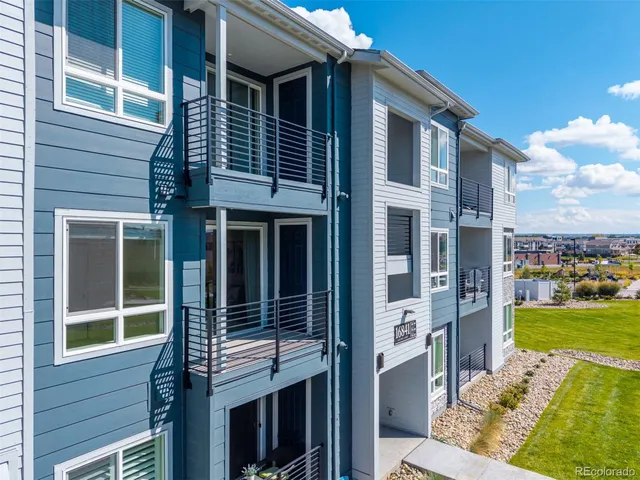 a front view of a house with a yard table and chairs
