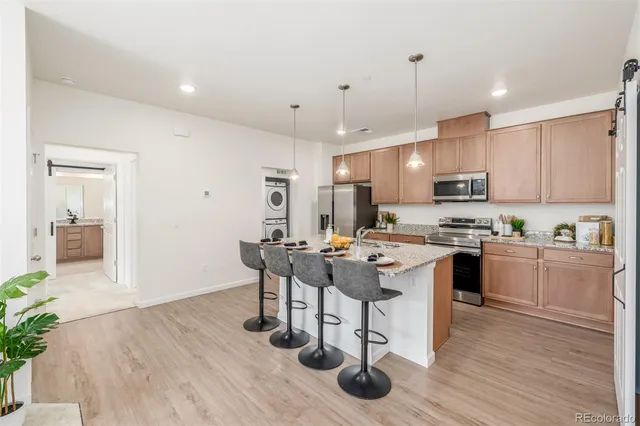 a kitchen with a sink a counter top space and appliances