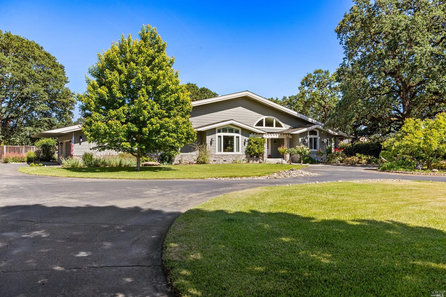 374 Laguna Vista Road Santa Rosa, CA 95401 - Photo 1 of 1 a front view of a house with a yard
